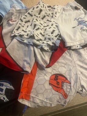 4 Pair of Boys Lax Shorts Medium. Fit 2 Win.  Used but no rips or stains.